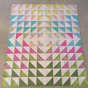A modern half square triangle quilt.