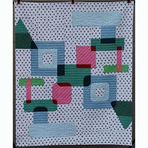 A modern quilt with large overlapping geometric shapes on a white with black palm tree background.