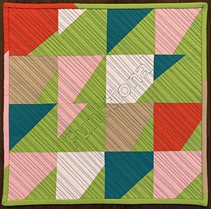 A modern mini quilt with impovisational half square triangles and the word "functional" spelled out in thread.