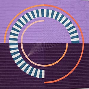 A purple quilt with a three-quarter circle of striped teal and white wedges, and thin orange three-quarter circles.