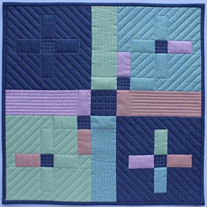 A mini quilt with plus designs in the piecing and in the negative space.