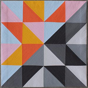 A bright, modern, half square triangle quilt.