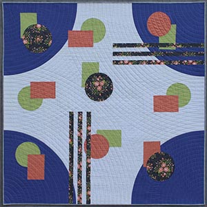 A modern quilt using periwinkle corner curves, floral circles and strips, and peach and lime circles with rectangles.